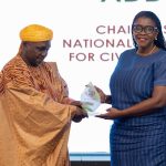 Kathleen Addy, NCCE Chairperson receiving Award from Rep of National Peace Council.
