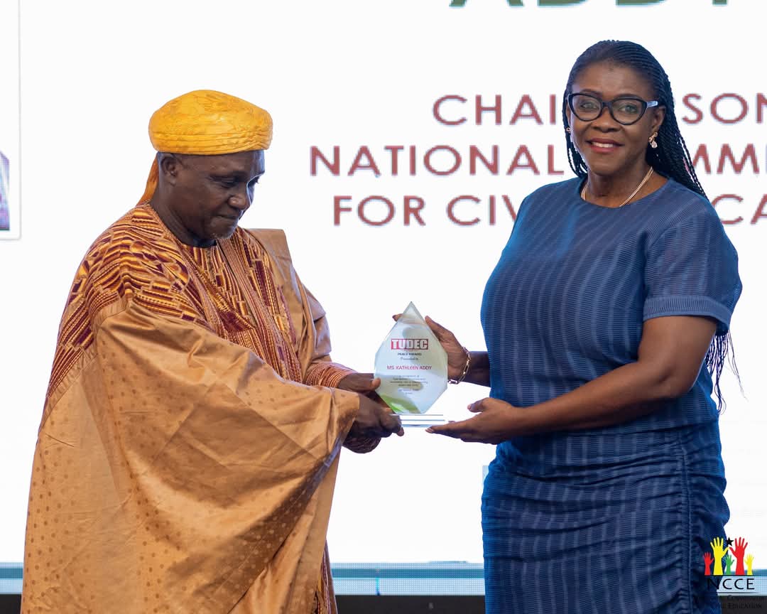 Kathleen Addy, NCCE Chairperson receiving Award from Rep of National Peace Council.