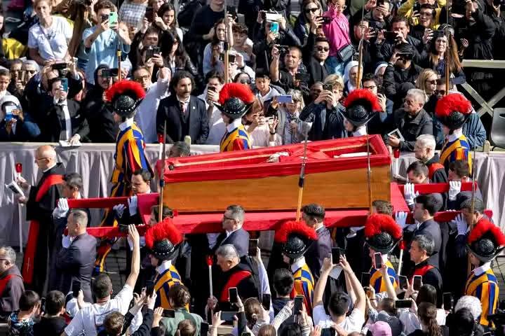 Pope Francis in the coffin with thousands of Mourners in the Vatican City.