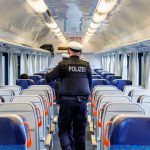 German police officers detain suspected people traffickers in raids