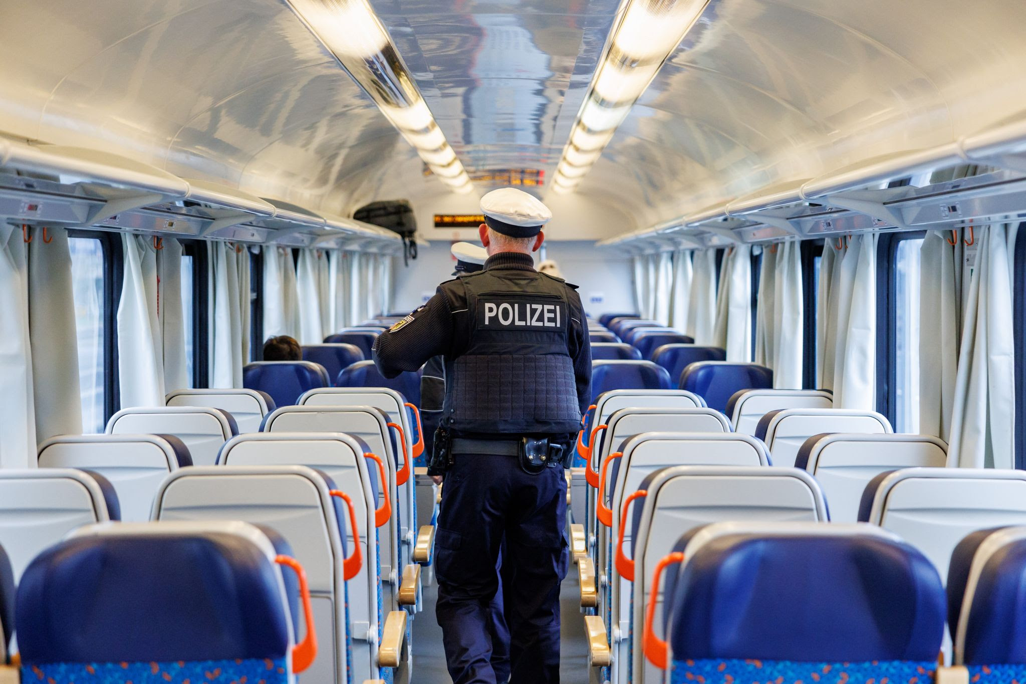 German police officers detain suspected people traffickers in raids