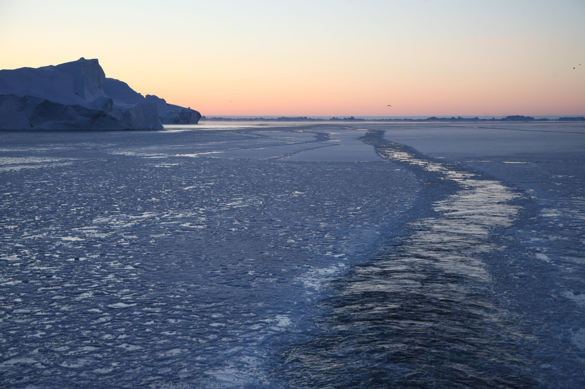 An icebreaker has made its way through the partially frozen Ilulissat Icefjord, while huge icebergs rise up next to it. Concern about the climate crisis plays only a minor role for employees in Germany, according to a study published on Saturday.