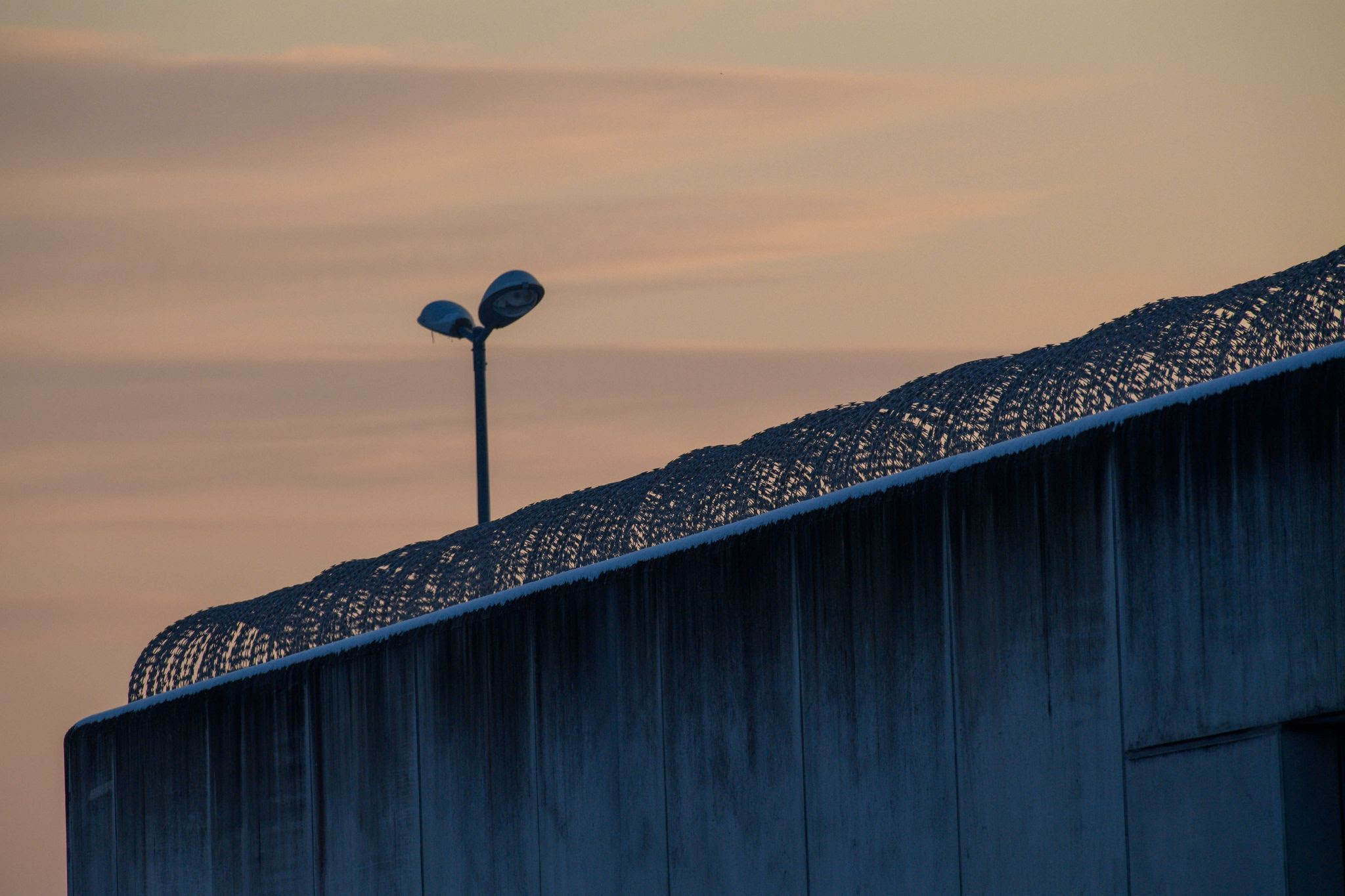 The day dawns over the wire-reinforced wall of Burg Prison. Following the violent death of a woman while she visited her husband in an east German prison, a judge ordered pre-trial detention on manslaughter charges for the man, based on a "strong suspicion" that he killed her.