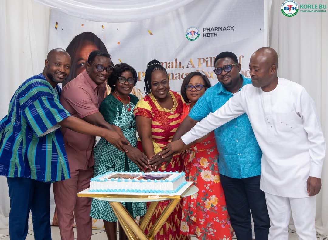 Pharmacy Directorate at Korle-bu in Accra organises send-off for former Director, Dr (Mrs.) Florence Amah Nkansah- (In red cloth , cutting cake with staff)