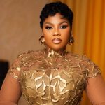 Empress Gifty in dazzling gold dress at TGMA 26