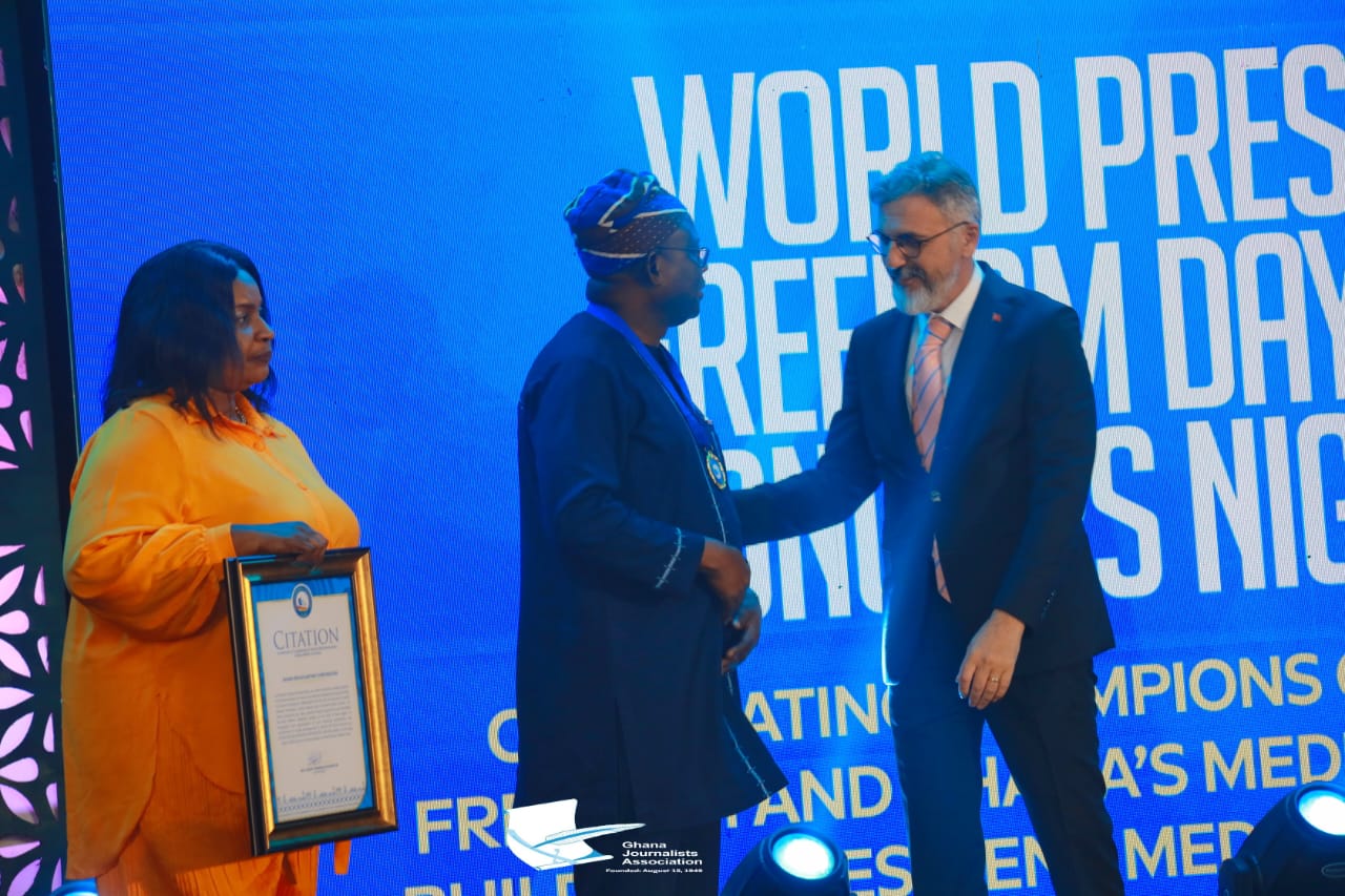 Rebecca Ekpe, (L) an Editor in Chief, at the Ghana Broadcasting Corporation joined the Director General of the Ghana Broadcasting Corporation, Prof. Amin Alhassan (M) on stage to receive a citation on behalf of the GBC for the Corporation's contribution to national information dissemination and freedom of expression on the occasion of World Press Freedom Day.