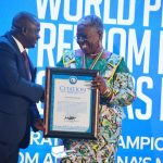 GJA President Albert Dumfour (L) presents Citation of honors to Mrs Gifty Afenyi Dadzie former GJA President as part of celebration Champions of Press Freedom during GJA's WPFD celebrations.