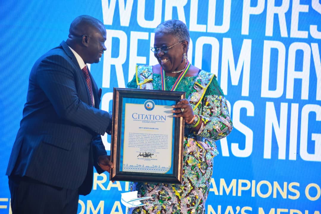 GJA President Albert Dumfour (L) presents Citation of honors to Mrs Gifty Afenyi Dadzie former GJA President as part of celebration Champions of Press Freedom during GJA's WPFD celebrations.