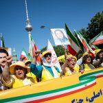 The rally was organized by the National Council of Resistance of Iran (NCRI), an organization of exiled Iranians, which is calling for a transition of power brought about by the people.