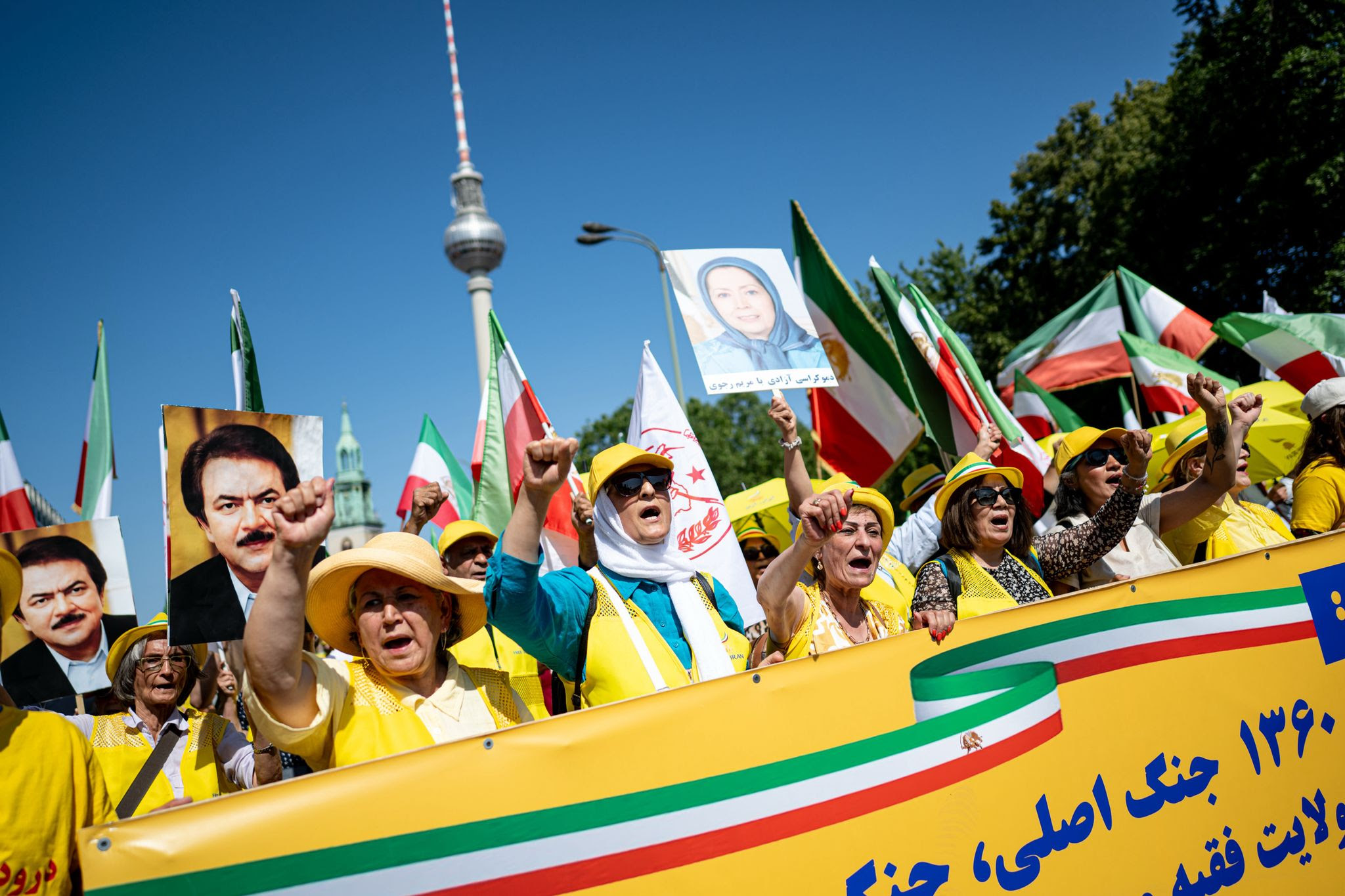 The rally was organized by the National Council of Resistance of Iran (NCRI), an organization of exiled Iranians, which is calling for a transition of power brought about by the people.