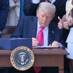 President Donald Trump signed his package of tax breaks and spending cuts into law Friday after his cajoling produced almost unanimous Republican support in Congress for the domestic priority that could cement his second-term legacy