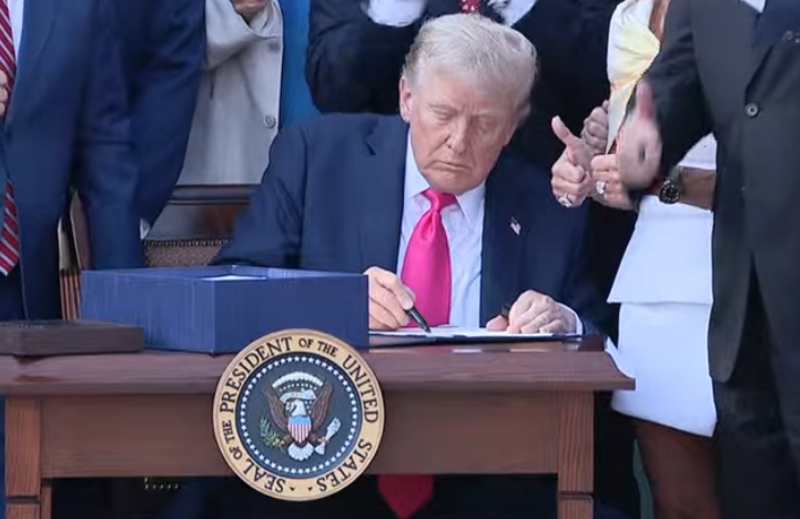 President Donald Trump signed his package of tax breaks and spending cuts into law Friday after his cajoling produced almost unanimous Republican support in Congress for the domestic priority that could cement his second-term legacy