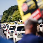 Cab drivers demonstrate for fair competition in the cab industry after a motorcade on the famous road Straße des 17. Juni in Berlin.