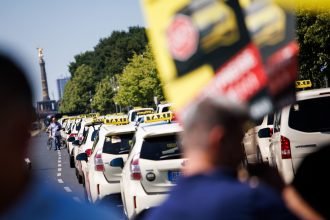 Cab drivers demonstrate for fair competition in the cab industry after a motorcade on the famous road Straße des 17. Juni in Berlin.