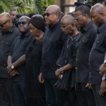 President John Mahama (middle) with Vice-President Prof. Naana Jane Opoku-Agyemang (4th from left), top government officials, and NDC national executives in a solemn mood during the flower-laying ceremony