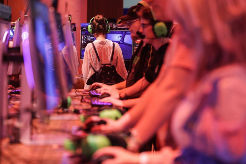 Computer gamers test "World of Warcraft" during the Gamescom video games fair in Cologne, which runs from 20 to 24 August 2025.