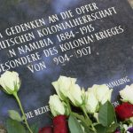 Flowers lie on July 7, 2015, at the memorial stone for the victims of German colonial rule in present-day Namibia at the Garrison Cemetery in Berlin.