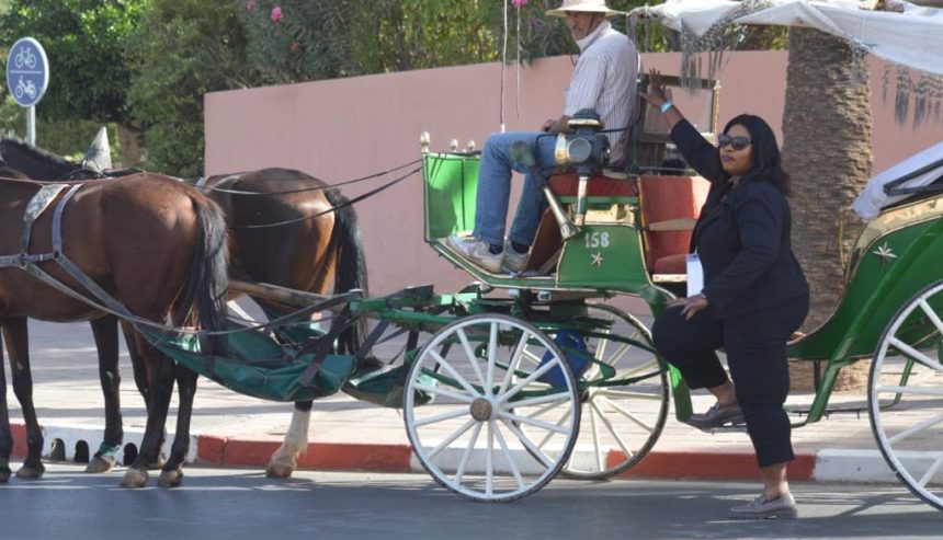 Tourists in streets of Marrakesh Morrocco.