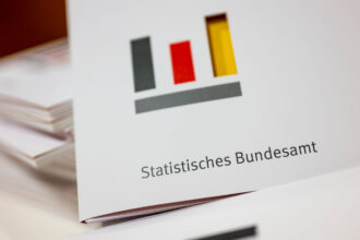 13 January 2023, Berlin: Folders labelled Federal Statistical Office and the office's logo lie on a table during a press conference. Photo: Monika Skolimowska/dpa