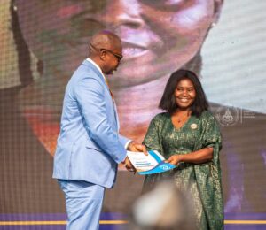 Rachel Kakraba receives award from COP Nathan Boakye RTD).