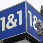 08 December 2023, Rhineland-Palatinate, Montabaur: The logo of the telecommunications provider 1&1 stands on the roof of the company headquarters. 1&1 plans to officially launch its mobile services on Friday afternoon. At the end of September, 60 antenna sites were ready for cell phone connections; 200 are to be activated by the beginning of 2024. Photo: Federico Gambarini/dpa