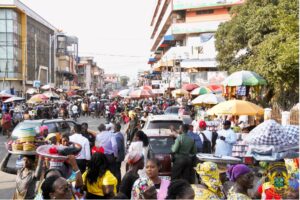 Trade Minister at Markets in Accra, advocating fair pricing.