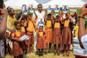 MP For Ketu North, Edem Agbana gifts pupils shoes, bags, books oh his birthday.