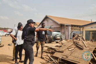 Tema Metropolitan Assembly Chief Executive, Ebi Bright (in black) leads clean-up campaign in city.