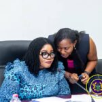 Director, Human Trafficking Secretariat, Madam Abena Annobea Asare engaging Gender Minister, Dr. Naa Momo Lartey (seated)