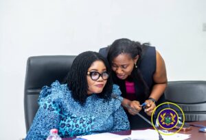 Director, Human Trafficking Secretariat, Madam Abena Annobea Asare engaging Gender Minister, Dr. Naa Momo Lartey (seated)