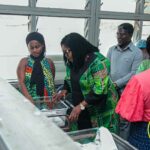 Gender Minister , Dr. Naa Momo Lartey with rescued baby