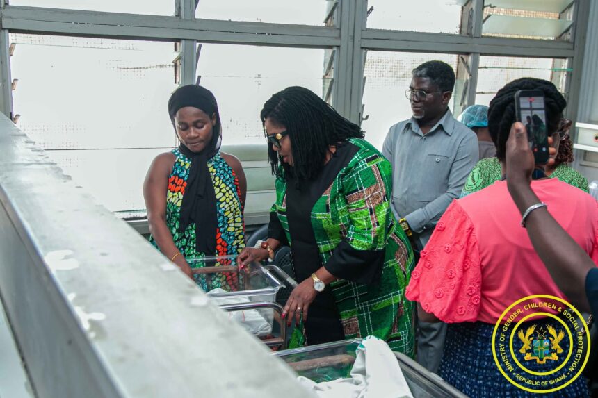 Gender Minister , Dr. Naa Momo Lartey with rescued baby