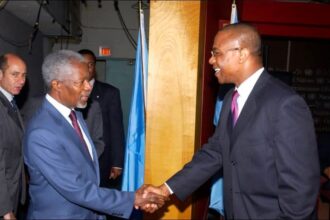 The young Ben Dotse Malor ( Right) shaking hands with Late UN Secretary General, Kofi Annan.
