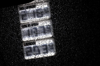 Gasoline and diesel prices can be seen on the display board of a gas station behind a rain-wet car window. Photo: Karl-Josef Hildenbrand/dp