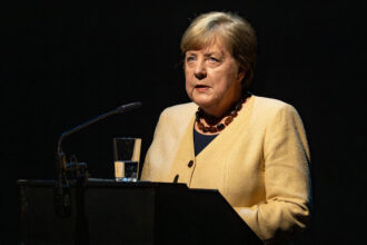 Former German Chancellor Angela Merkel speaks at the Berliner Ensemble (BE) during the presentation of the book "Auf den Strassen Teherans" (On the Streets of Tehran) Written by an Iranian author using the pseudonym NILA-who must remain anonymous for security reasons. Photo: Soeren Stache/dpa