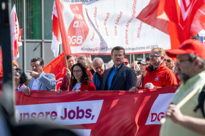 Yasmin Fahimi, head of the German Trade Union Confederation, marches through Nuremberg alongside other demonstrators. The slogan for this year's May Day rallies is: "Our jobs first, your profits second." Photo: Pia Bayer/dpa