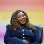 Former US tennis player Serena Williams sits on stage at the OMR digital trade show in the exhibition halls. Credit: Marcus Brandt/dpa