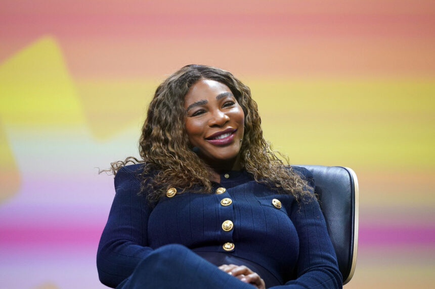 Former US tennis player Serena Williams sits on stage at the OMR digital trade show in the exhibition halls. Credit: Marcus Brandt/dpa