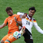 Germany defender Nathaniel Brown and Ivory Coast winger Amad Diallo battle for possession during the FIFA World Cup Group E match between Germany and Ivory Coast at Toronto Stadium in Toronto. Photo: Christian Charisius/dpa