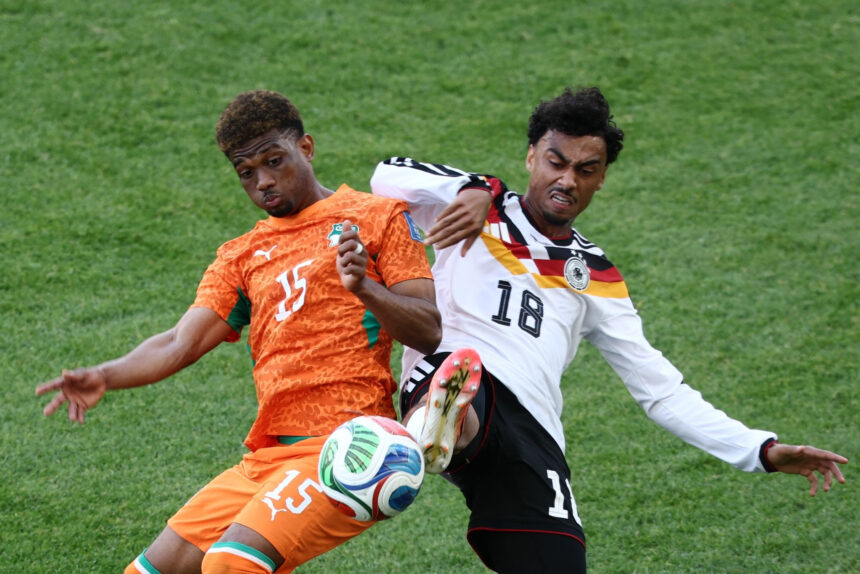 Germany defender Nathaniel Brown and Ivory Coast winger Amad Diallo battle for possession during the FIFA World Cup Group E match between Germany and Ivory Coast at Toronto Stadium in Toronto. Photo: Christian Charisius/dpa