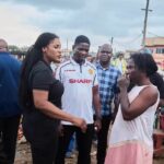 Ebi Bright, MCE of Tema Municipal Assembly-left interacting with citizens accessing flood risk areas.