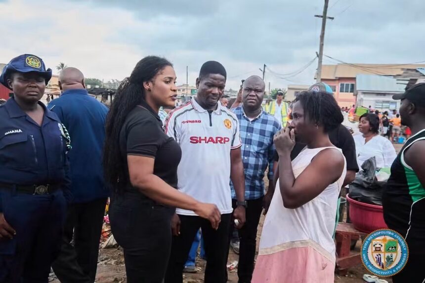 Ebi Bright, MCE of Tema Municipal Assembly-left interacting with citizens accessing flood risk areas.