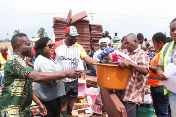 Gender Minister, Dr. Agness Naa Momo Lartey extends support to flood victims.