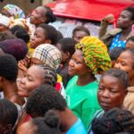 Victims of floods in Accra, Ghana queue for relief items.