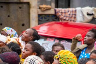 Victims of floods in Accra, Ghana queue for relief items.