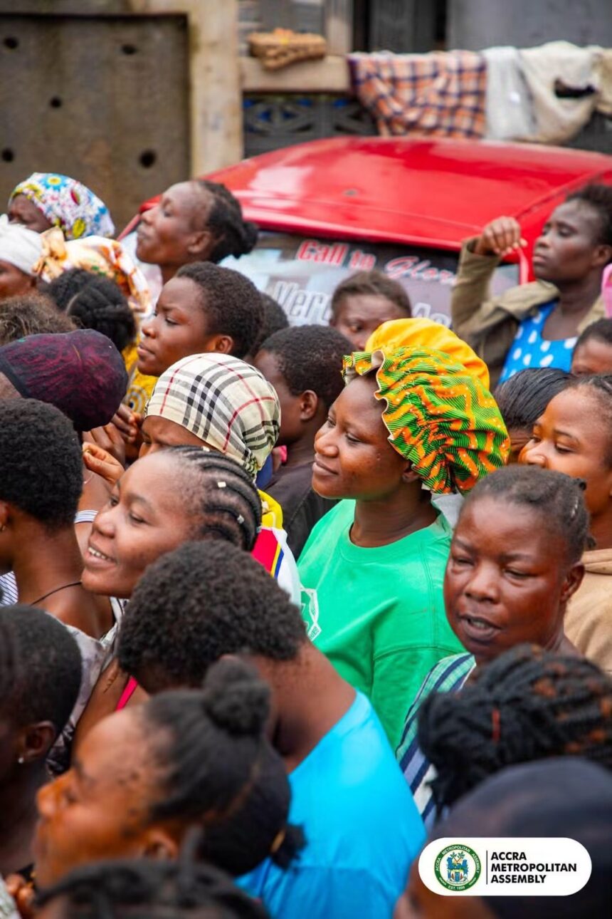 Victims of floods in Accra, Ghana cue for relief items.