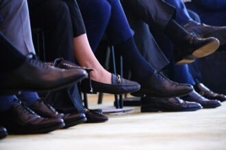 FILE PHOTO - A woman sits among numerous men at the 2024 Family Business Day at the Hotel Adlon. Photo: Bernd von Jutrczenka/dpa