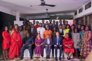 GJA Vice President Rebecca Ekpe (seated in Red) with UK High Commissioner- Christain Rogg, Dr. Zanetor Agyemang Rawlings, Minister of Environmnet Science and Technology and other officialls -seated with UK MEET Journalists.