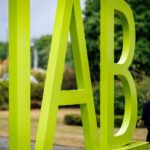 A large lettered logo of the Institute for Employment Research (IAB) of the Federal Employment Agency stands in front of the agency's building in Nuremberg. Photo: Daniel Karmann/dpa