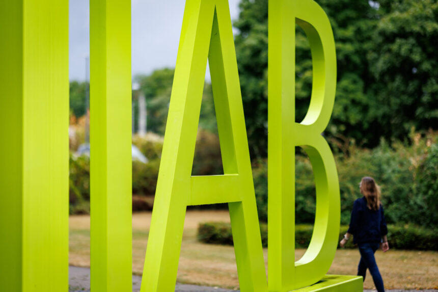 A large lettered logo of the Institute for Employment Research (IAB) of the Federal Employment Agency stands in front of the agency's building in Nuremberg. Photo: Daniel Karmann/dpa